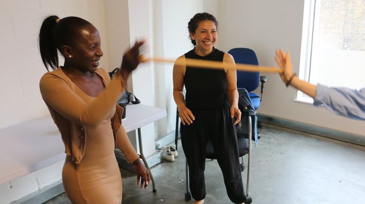 Participants move around the studio space during a workshop with Hilanderas.with